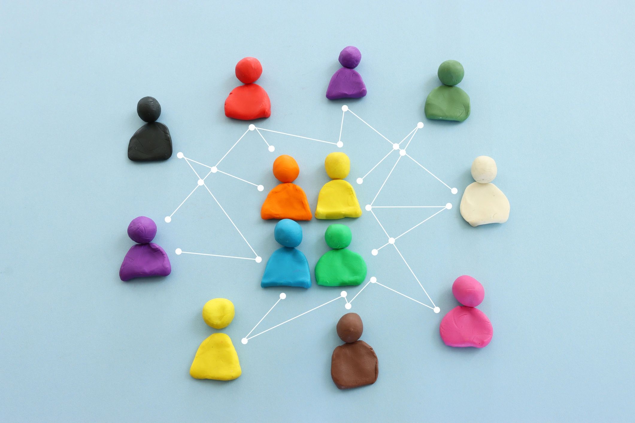 Colorful figures connected over blue background, concept of community